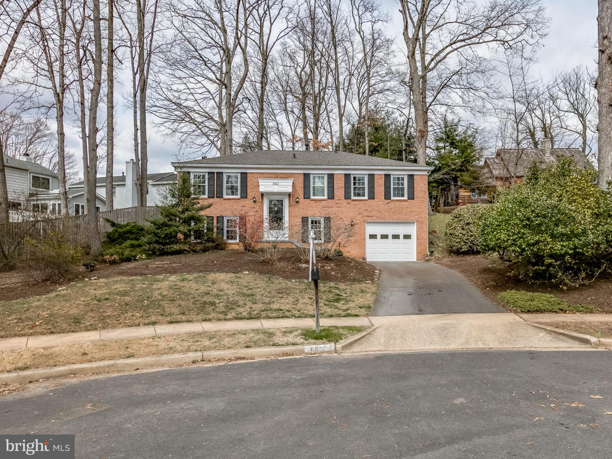 6502 Shipyard Place Falls Church, VA 22043 - Photo 30 of 30 a view of a house with a yard and large trees