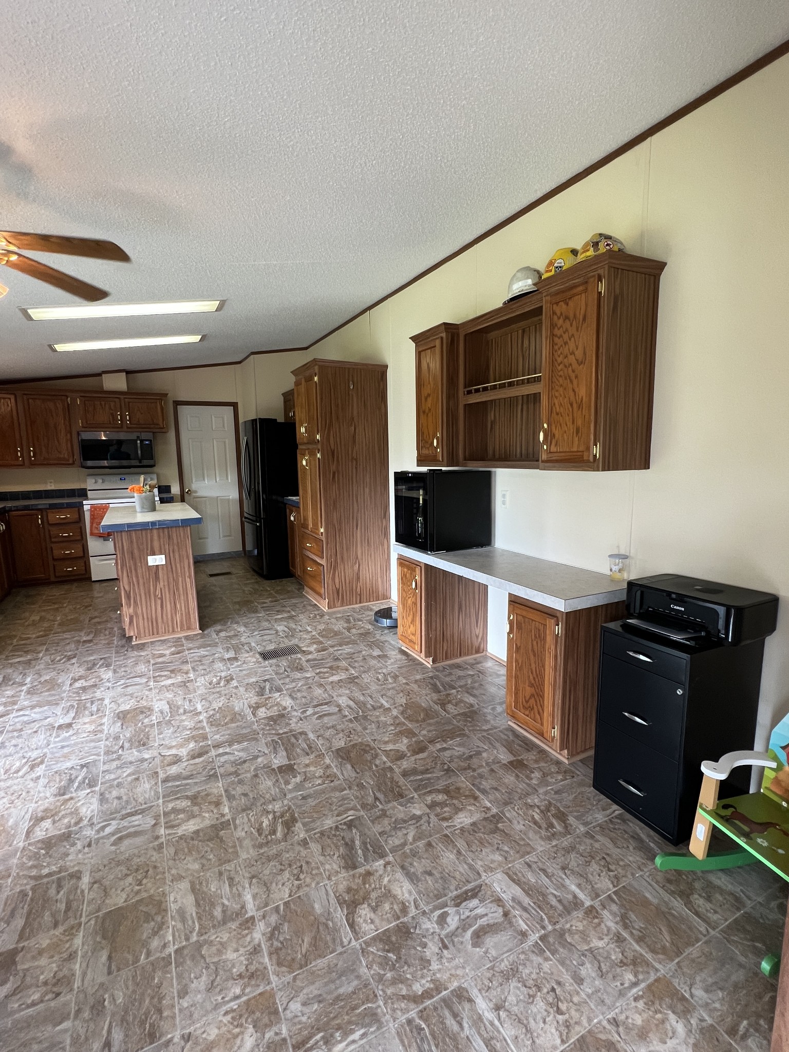 3538 Beasleys Bend Road Lebanon, TN 37087 - Photo 34 of 49 a kitchen with stainless steel appliances a refrigerator and a stove top oven