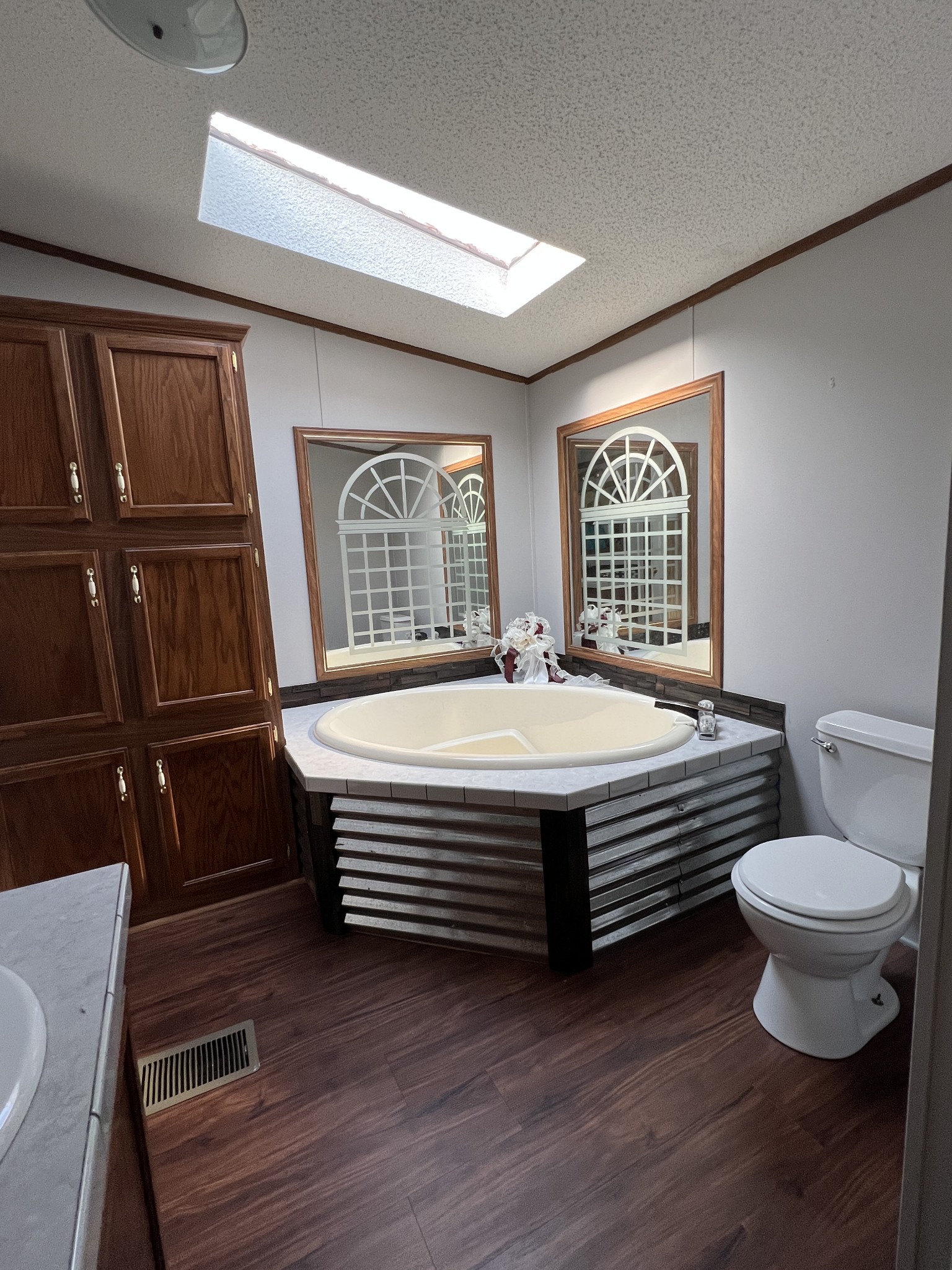 3538 Beasleys Bend Road Lebanon, TN 37087 - Photo 40 of 49 a bathroom with a toilet a sink and a large mirror