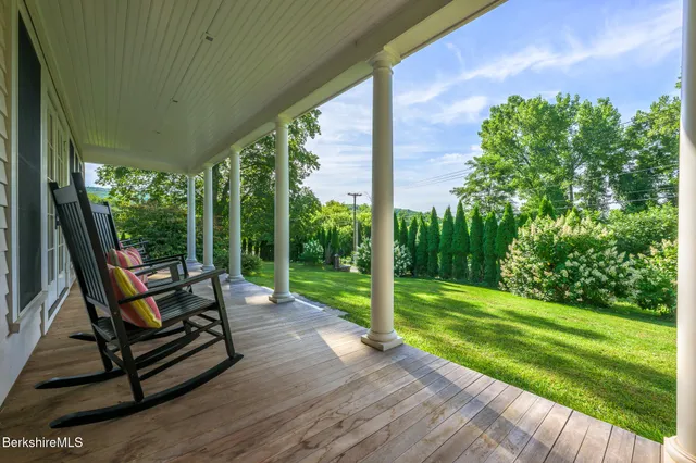 a view of a two chair in the patio of the house