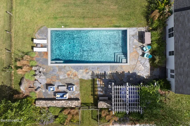 a view of a patio with chairs and a table