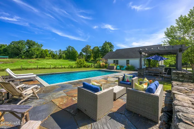 a bed room with furniture and a chandelier