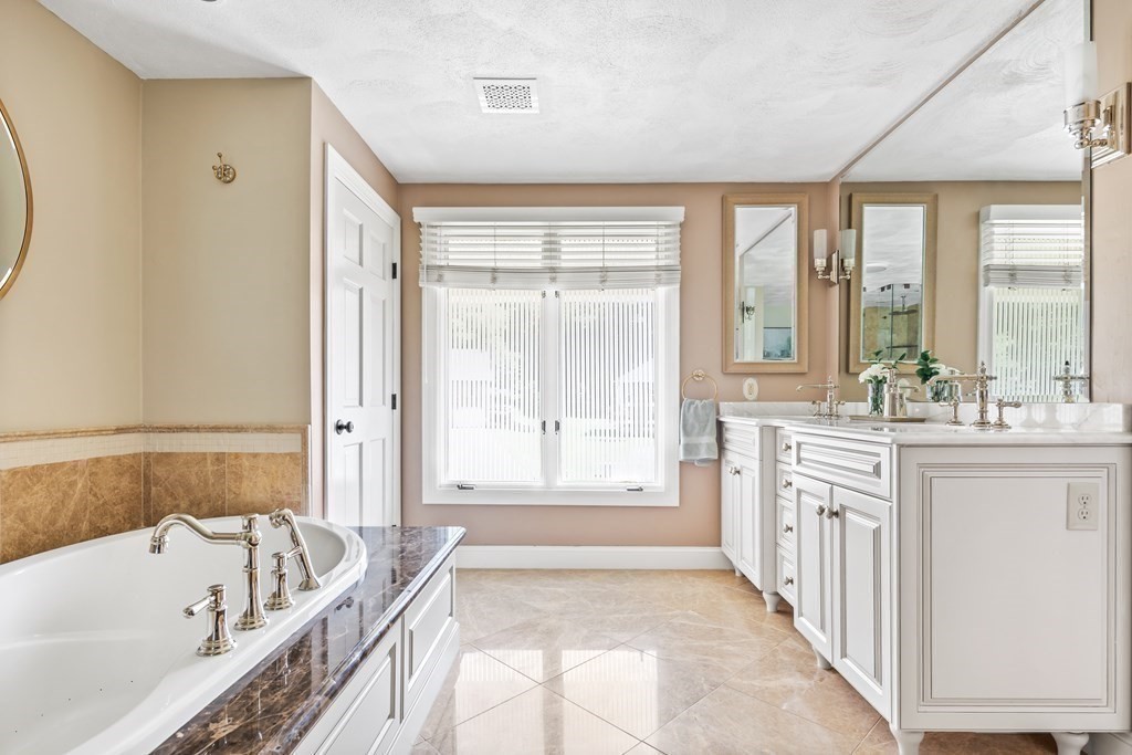 6 David Drive Andover, MA 01810 - Photo 19 of 41 a bathroom with a granite countertop tub sink and mirror