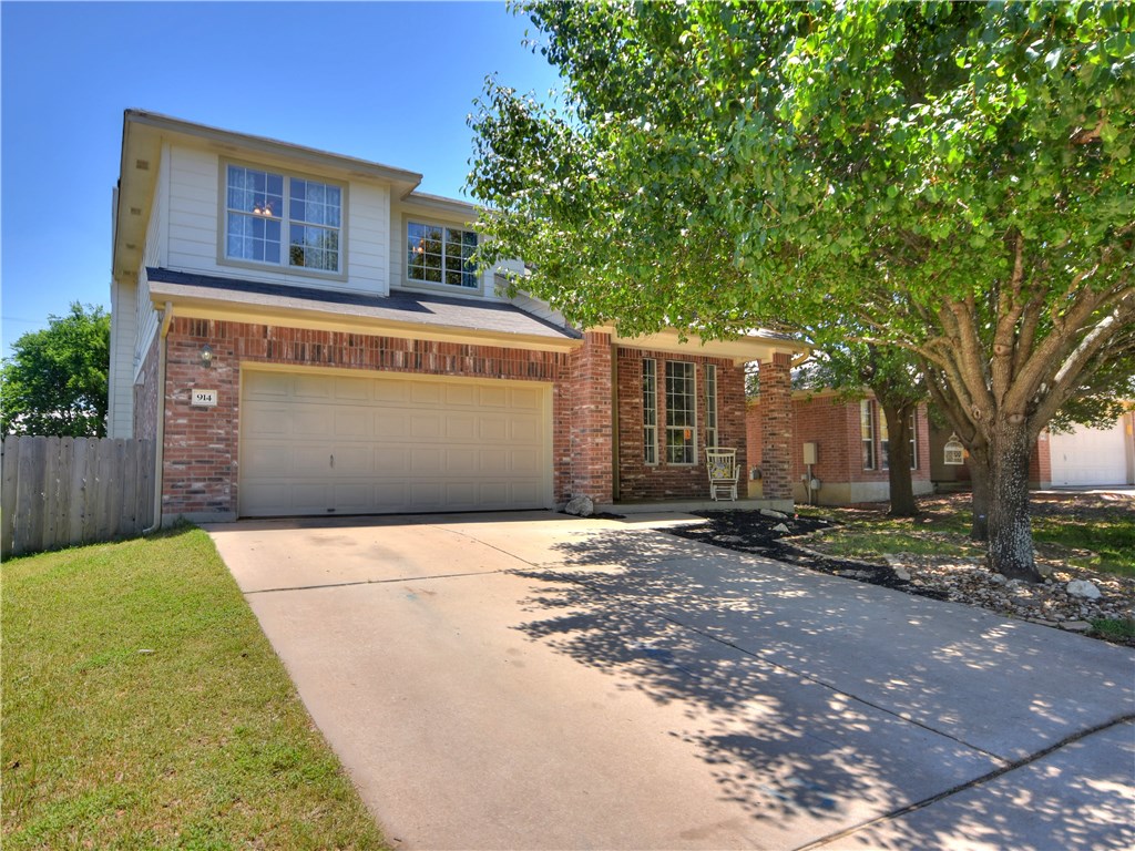 914 Cedar Crest Drive Cedar Park, TX 78613 - Photo 1 of 1 a front view of a house with a yard and garage