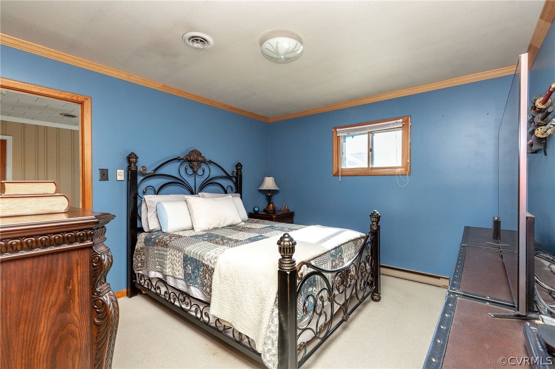 17 Medlock Road Sandston, VA 23150 - Photo 12 of 32 The Primary Bedroom had Carpet, Crown Molding, and