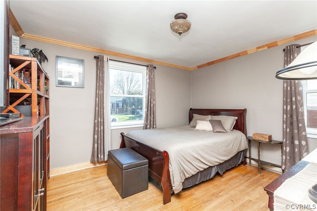 17 Medlock Road Sandston, VA 23150 - Photo 24 of 32 This bedroom has Harwood Floors, Crown Molding, an