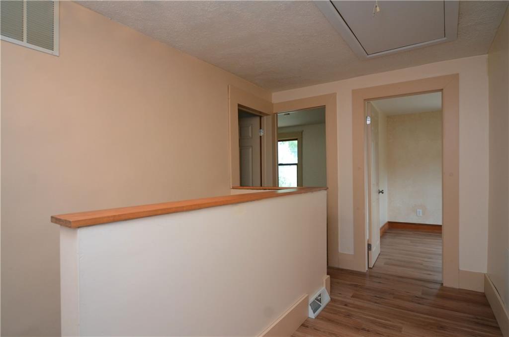 221 Highway 68 Rochester, PA 15074 - Photo 13 of 25 a view of hallway with wooden floor