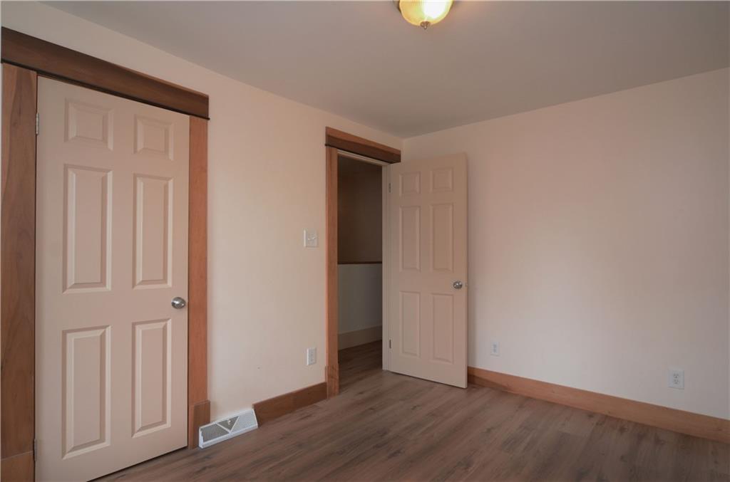221 Highway 68 Rochester, PA 15074 - Photo 16 of 25 an empty room with wooden floor and closet area