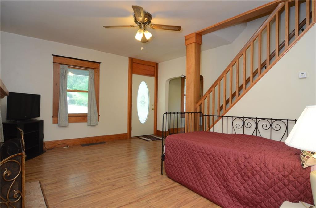221 Highway 68 Rochester, PA 15074 - Photo 4 of 25 a bedroom with a bed and a flat screen tv