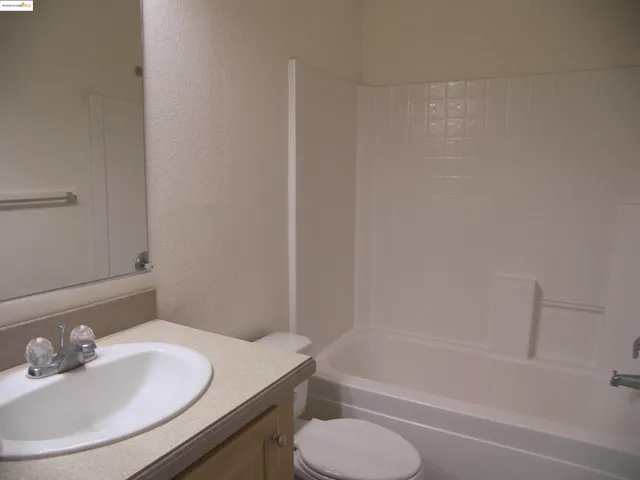 a bathroom with a sink toilet and bathtub