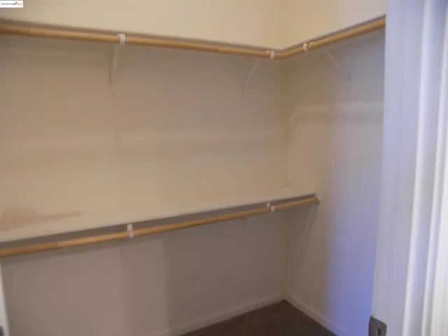 a view of a room with shelf on the wall