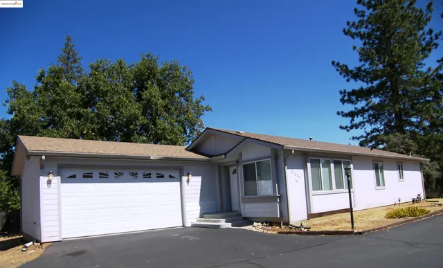 a front view of a house with a garage