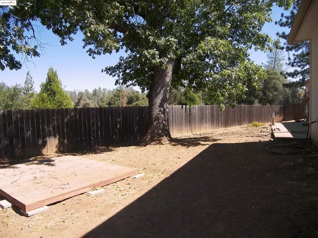 a swimming pool with wooden fence