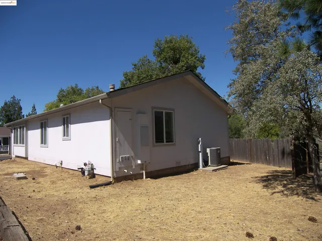 a house with trees in the background