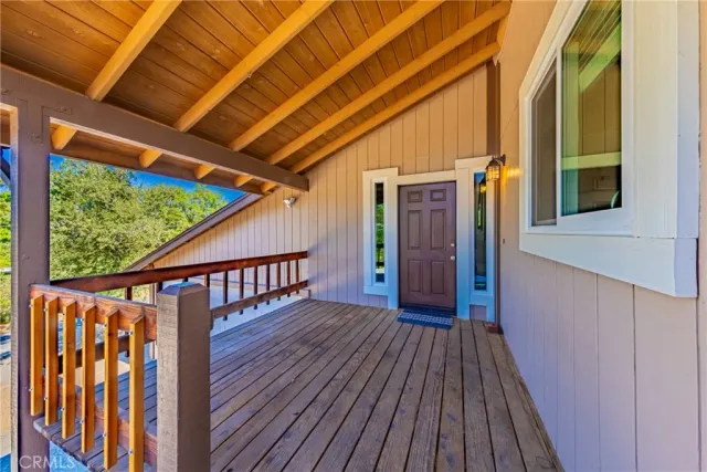 a view of balcony with wooden floor