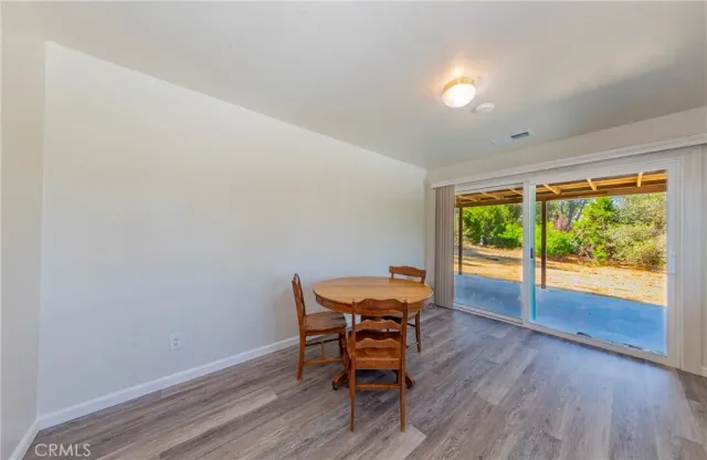 a workspace with furniture and wooden floor