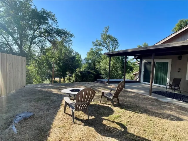 a view of a backyard with sitting area