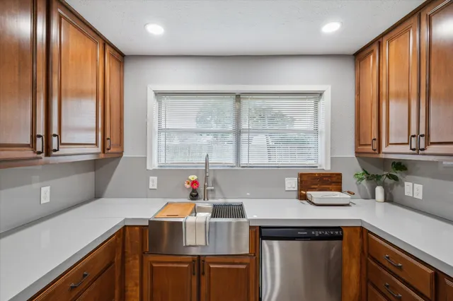 a kitchen with a sink and a window