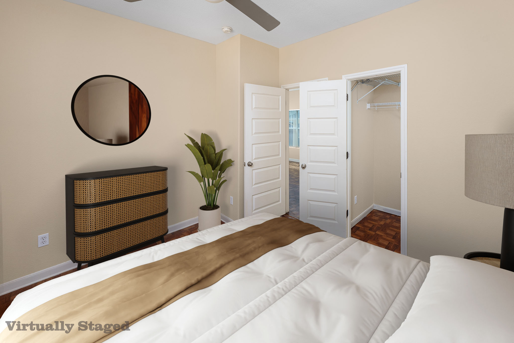 2829 Saville Loop, Unit 17C Austin, TX 78741 - Photo 8 of 28 A restful chamber showcasing wood flooring and convenient closet access.