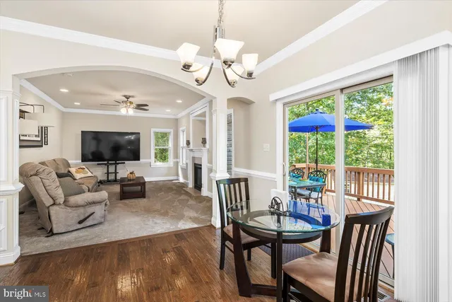 a living room kitchen with furniture and kitchen view