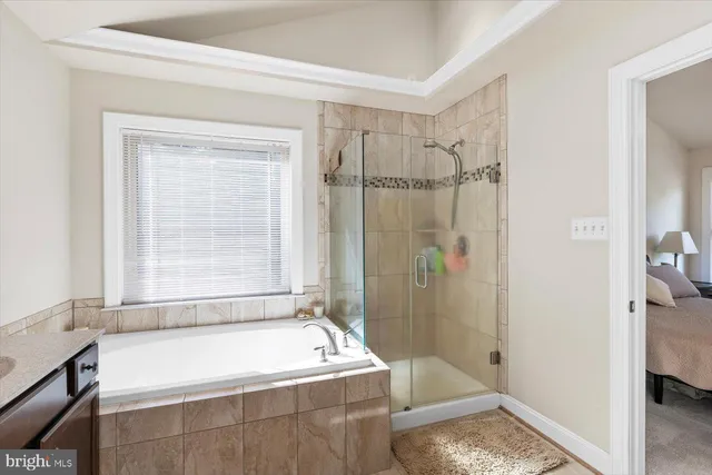 a bathroom with a sink a toilet a mirror and shower curtain