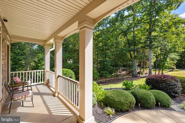 a view of a dining room with furniture wooden floor and chandelier
