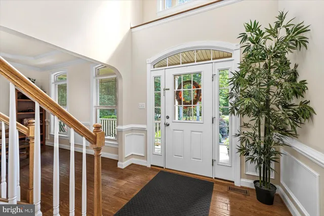 a kitchen with stainless steel appliances granite countertop a refrigerator sink and stove