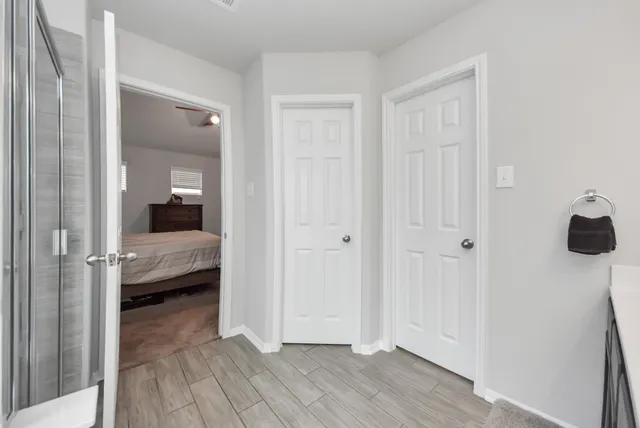 a view of a bedroom from a hallway