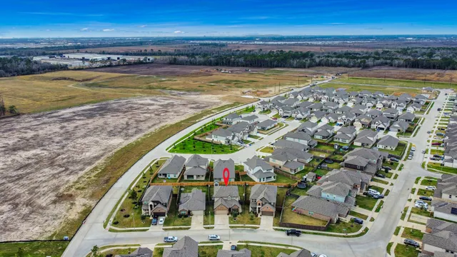 a view of a swimming pool with furniture