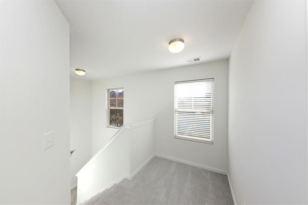 541 Tulip Lane McDonough, GA 30252 - Photo 12 of 32 an empty room with windows