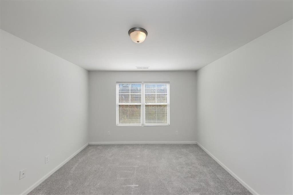 541 Tulip Lane McDonough, GA 30252 - Photo 14 of 32 an empty room with a window