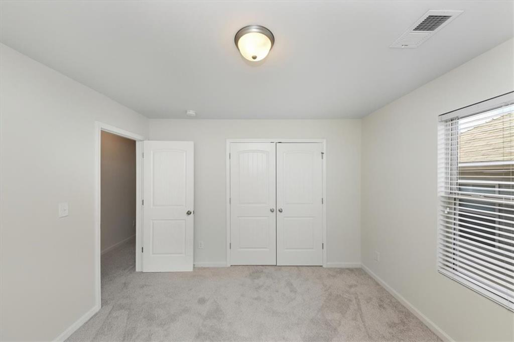 541 Tulip Lane McDonough, GA 30252 - Photo 15 of 32 a view of an empty room with a window