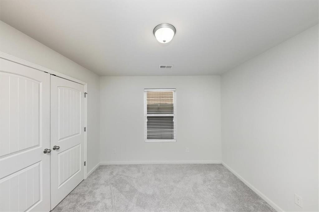 541 Tulip Lane McDonough, GA 30252 - Photo 16 of 32 a view of an empty room with a window