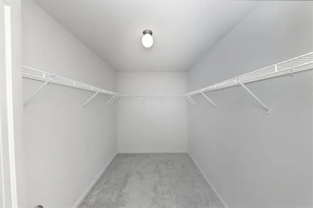 a view of an empty walk in closet