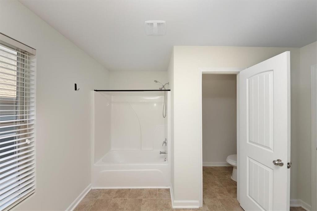 541 Tulip Lane McDonough, GA 30252 - Photo 26 of 32 a bathroom with a bathtub
