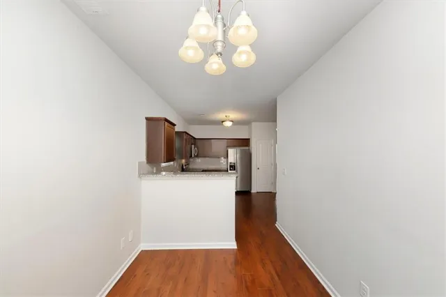 a view of a kitchen and a window