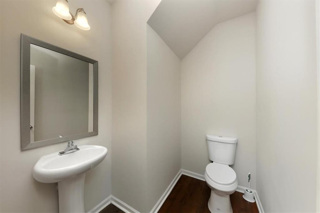 541 Tulip Lane McDonough, GA 30252 - Photo 10 of 32 a bathroom with a sink toilet and a mirror