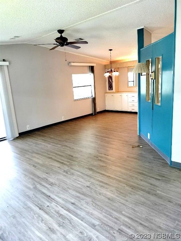 168 Red Bass Lane Edgewater, FL 32141 - Photo 2 of 14 a view of a refrigerator in kitchen and wooden floor
