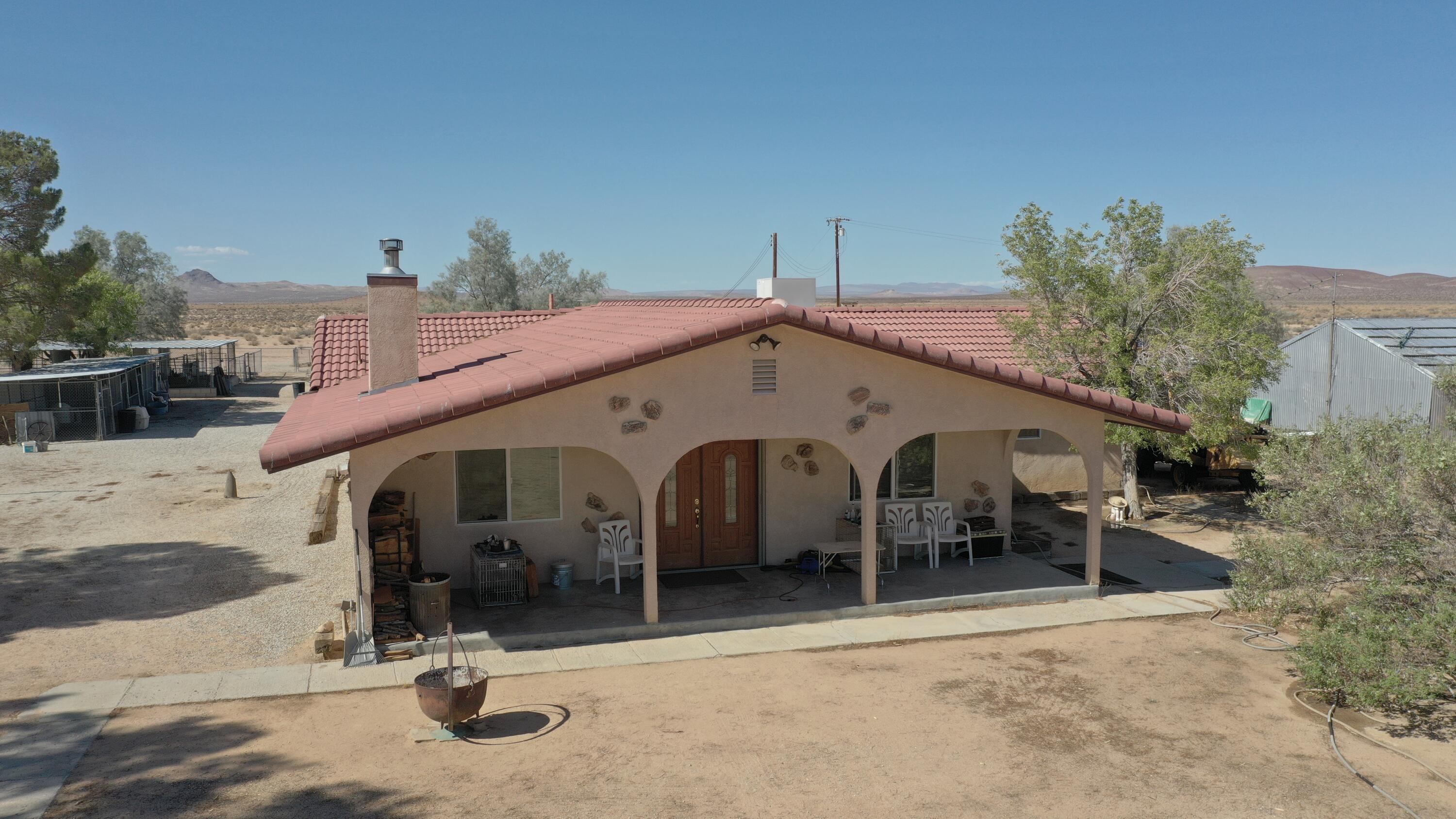 Castle Butte Road North Edwards, CA 93523 - Photo 20 of 22 a front view of a house with a yard