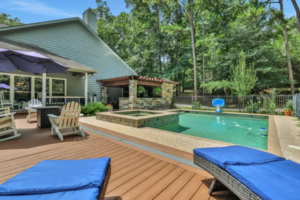 a view of a swimming pool with a patio