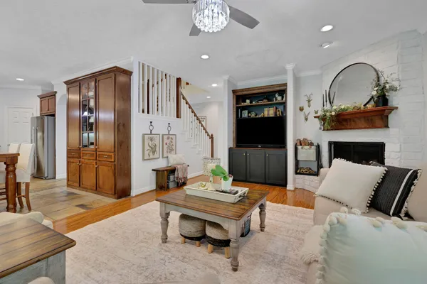 a living room with furniture and a fireplace