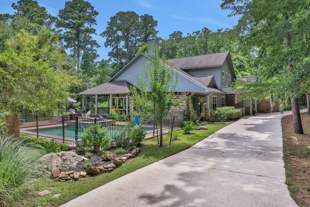 a front view of house with a garden