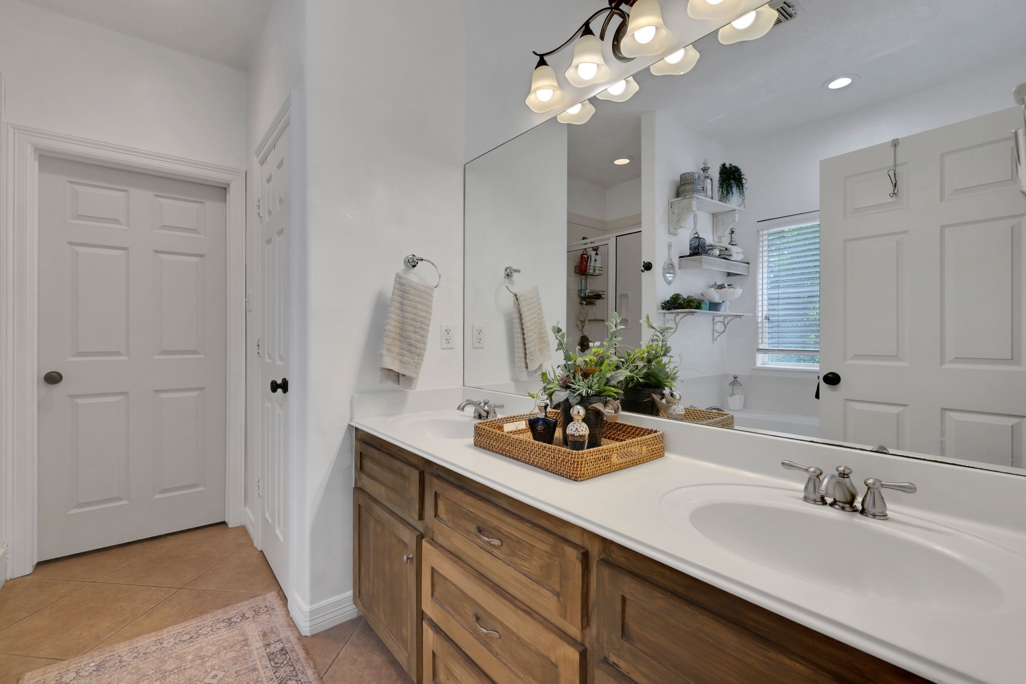 991 Kings Way Coldspring, TX 77331 - Photo 22 of 49 a bathroom with a sink double vanity and a mirror