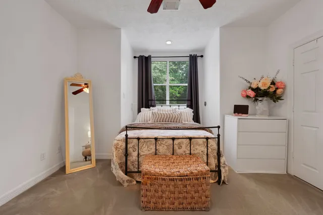 a bedroom with furniture and window