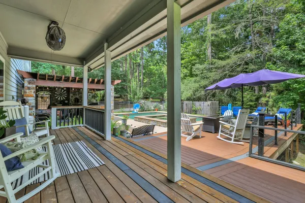 a view of balcony with wooden floor