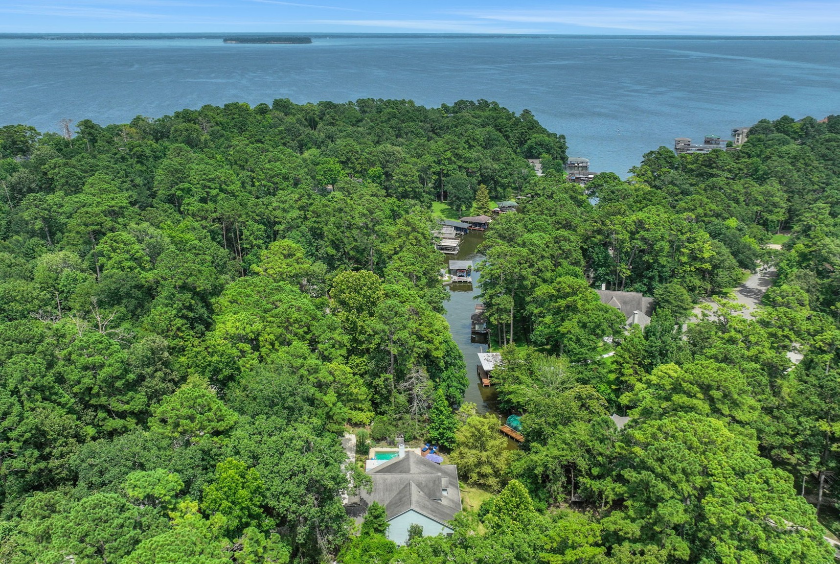 991 Kings Way Coldspring, TX 77331 - Photo 43 of 49 a view of a lake with a yard
