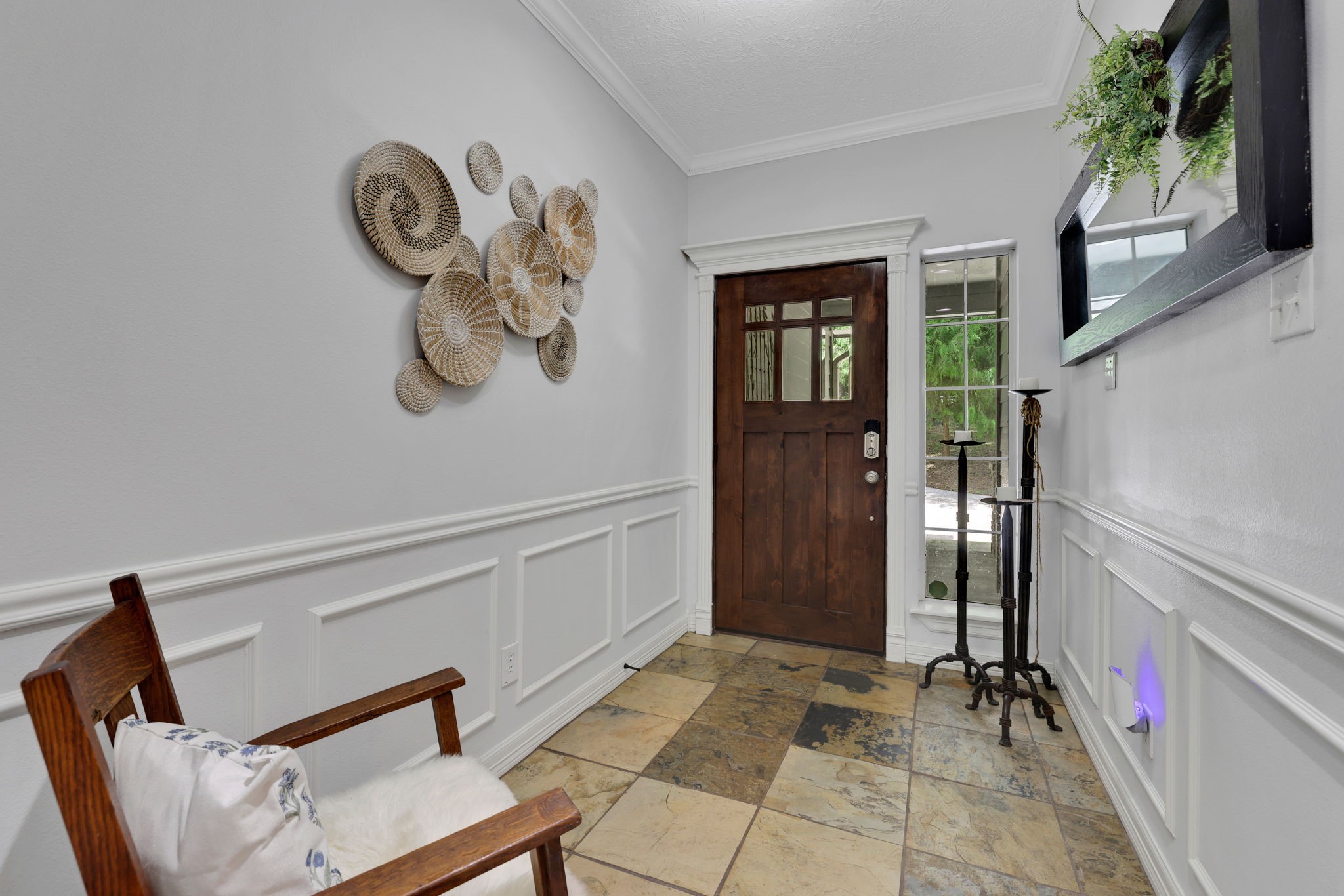 991 Kings Way Coldspring, TX 77331 - Photo 7 of 49 a view of a hallway with entryway wooden floor and front door
