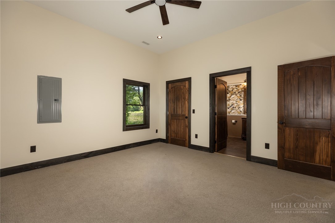 790 Howard Edmisten Road Sugar Grove, NC 28679 - Photo 14 of 45 an empty room with closet and windows