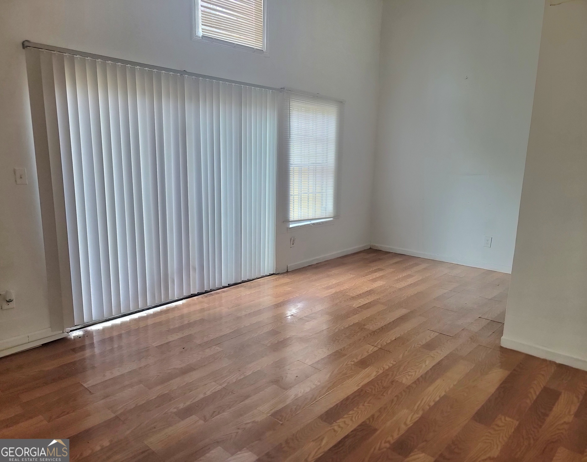 3166 Citrus Court Decatur, GA 30034 - Photo 1 of 1 an empty room with wooden floor and windows