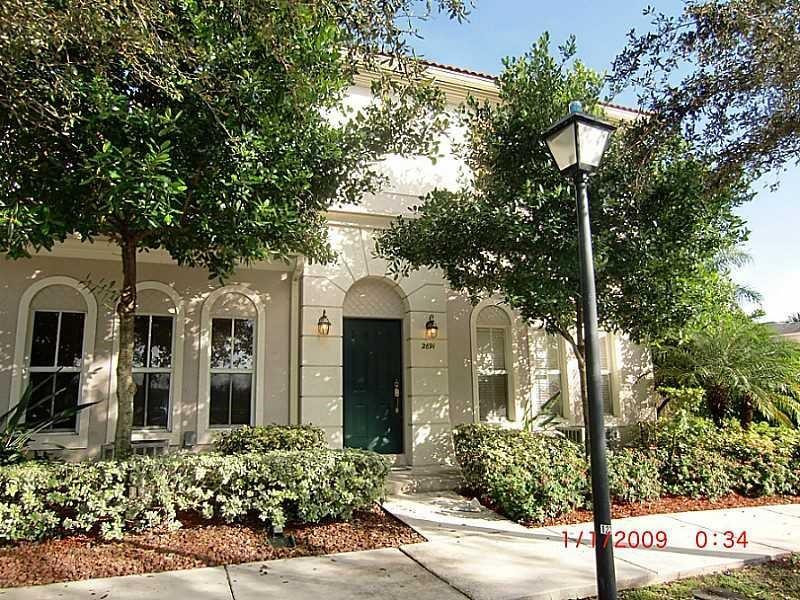 2691 Southwest 99th Way, Unit 2691 Miramar, FL 33025 - Photo 1 of 17 a front view of a house with trees